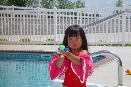 Kasen shooting Mommy with the water gun
